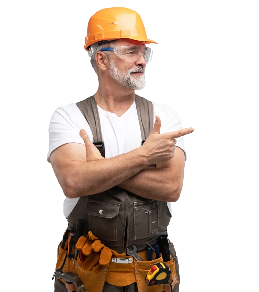 Construction worker wearing a hard hat and tool belt pointing to the side.